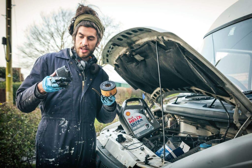 mike changing the oil filter in LDV campervan
