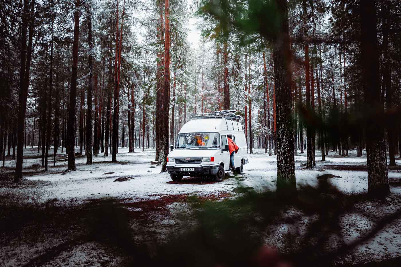 camping in van in swedish woodland with snow