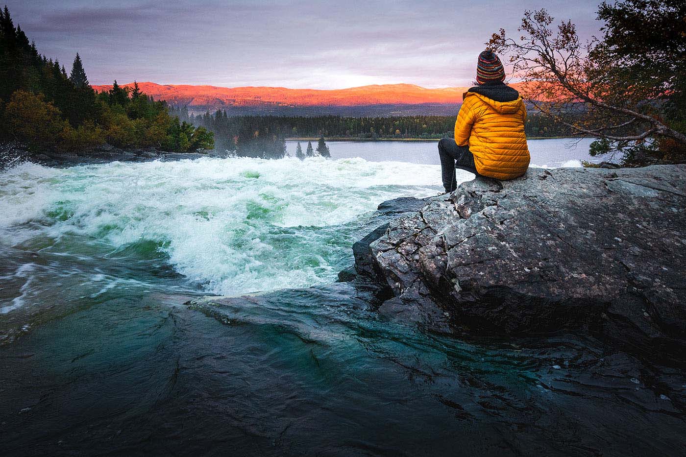 taking in the view of Tännforsen waterfall
